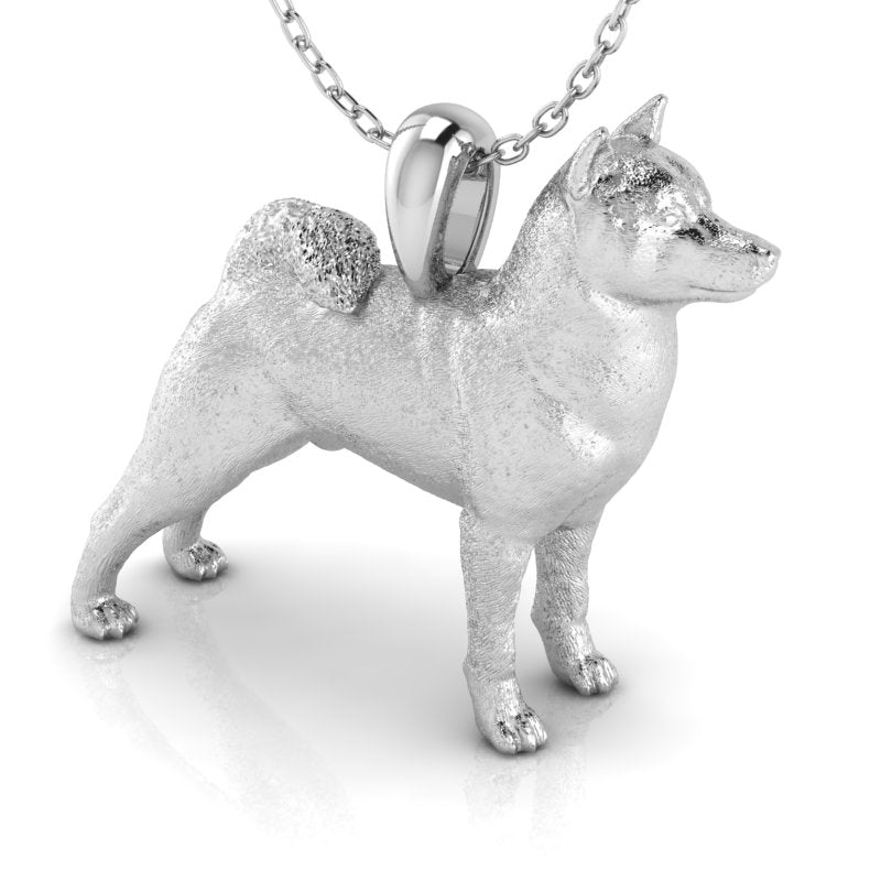 Silver dog pendant necklace with textured fur details on a chain, perfect accessory for dog lovers and jewellery enthusiasts worldwide, also available in solid gold. Made by Chris Simpson Designs in the United Kingdom.